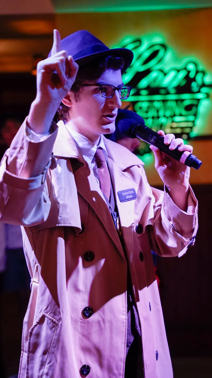 A Murder Mystery Company actor working the room at a Wilmington show